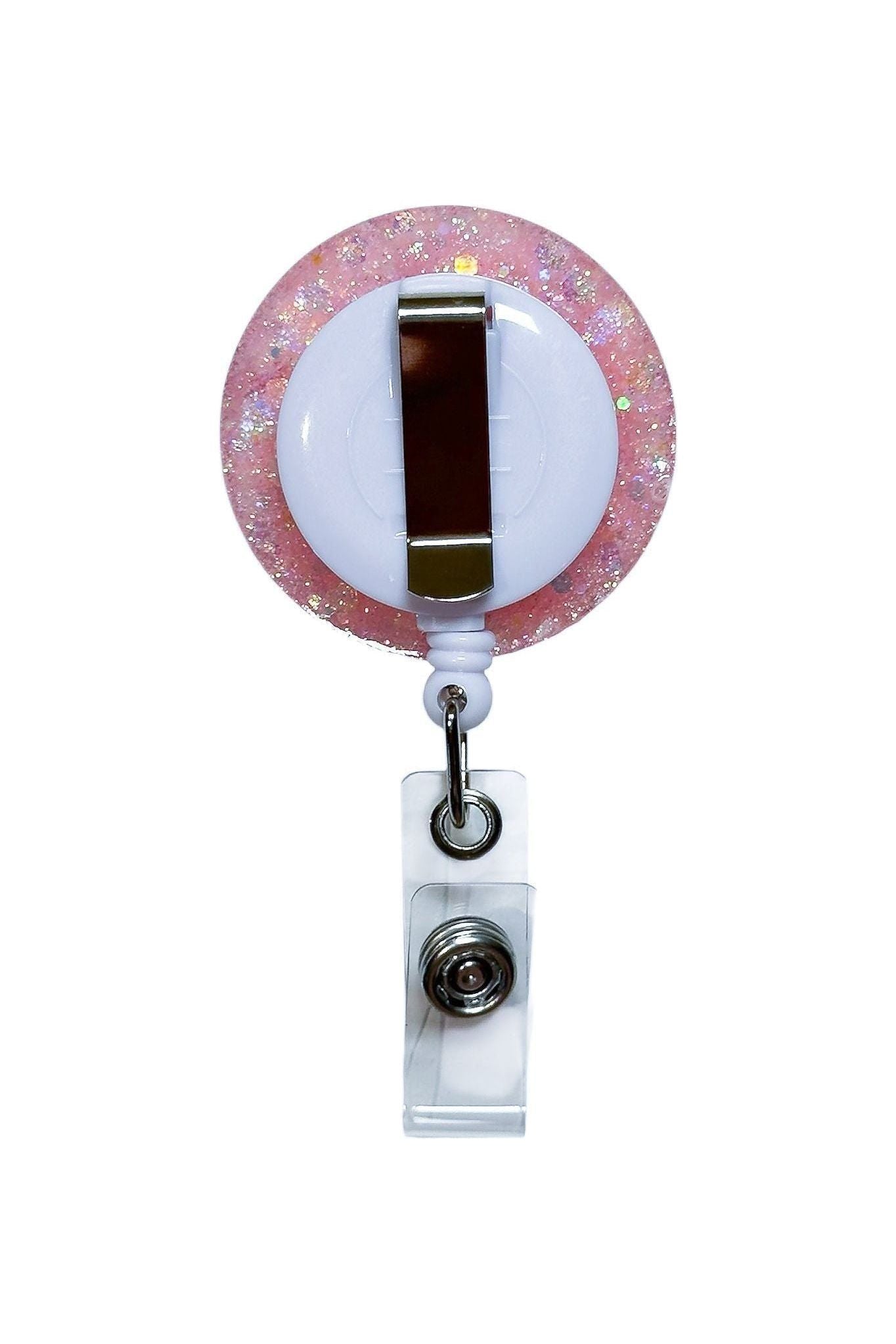 Back of resin badge reel showing retractable clip for uniforms