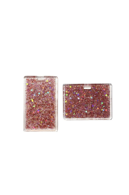 Two pink glittery card holders on a clear background