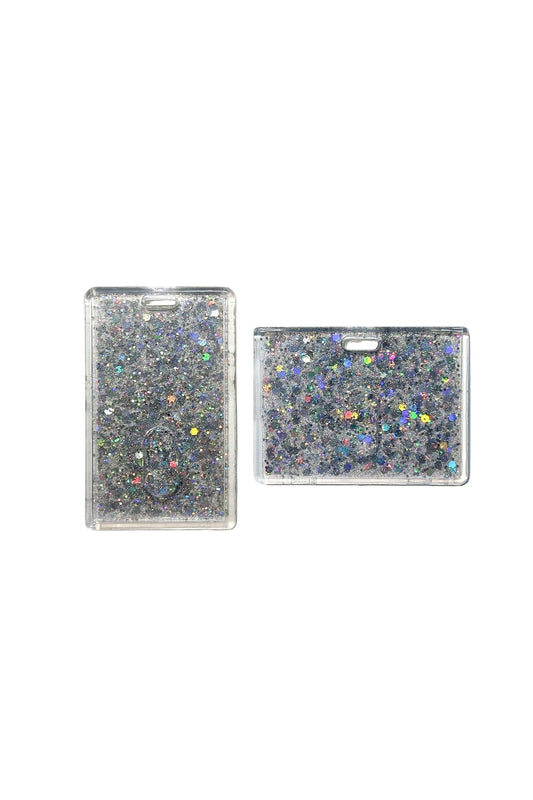 Two glittery rectangular card holders on a clear background
