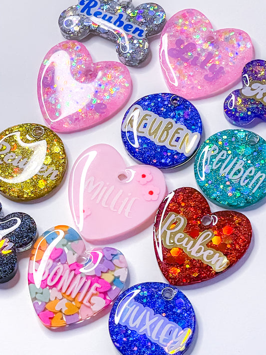 Close up of resin dog tag designs, custom dog tags, pet tags, pet id tags