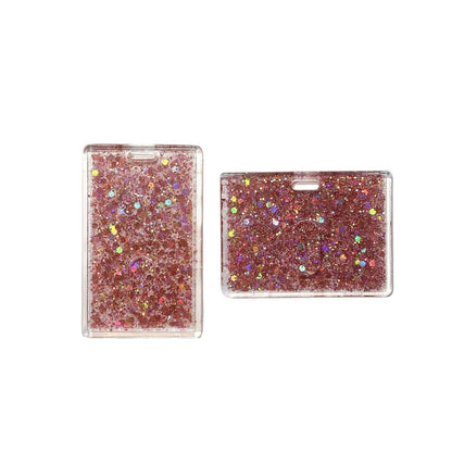 Two pink glittery card holders on a clear background