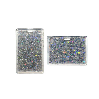 Two glittery rectangular card holders on a clear background